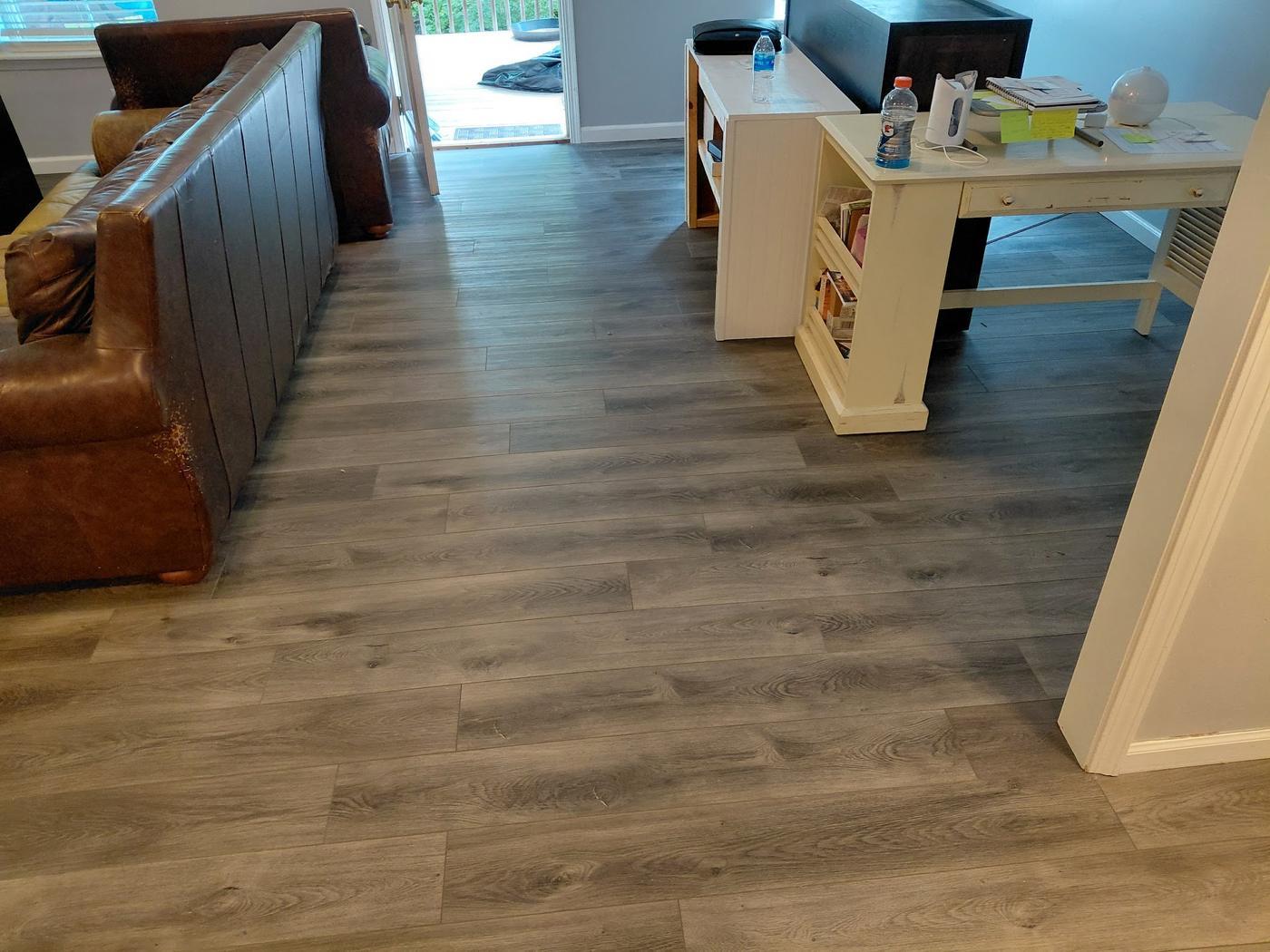 Grey toned plank floor in a furnished living room